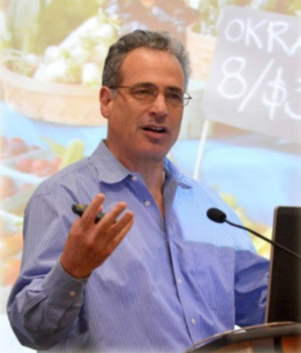 Michael Shuman speaking at an event about local economics